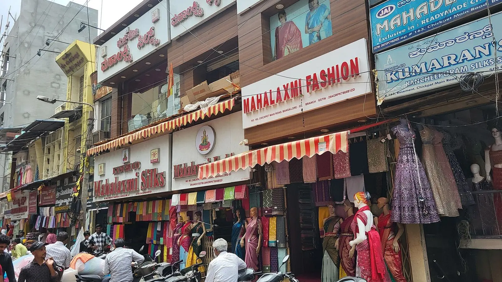 A busy Chickpet street in Bengaluru lined with saree, fabric and clothing shops