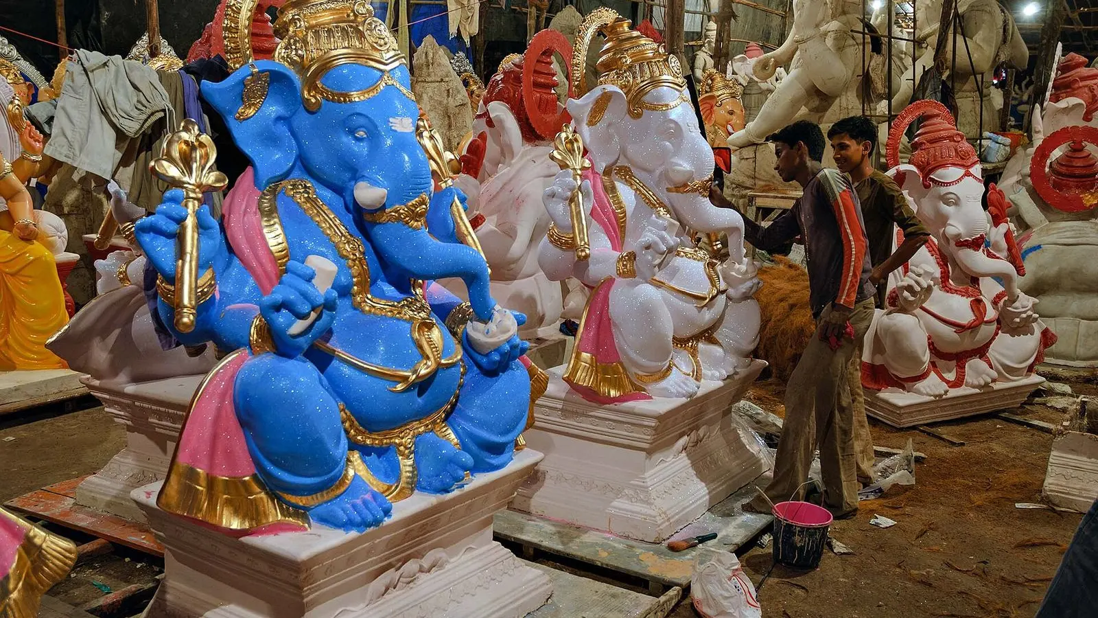 Ganesh statues being made and painted in a large workshop in Mumbai before Ganesh Chaturthi